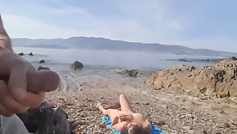 Daring Man Exposes Himself To A Nudist Milf Who Eagerly Gives Him Oral Pleasure On The Beach